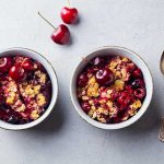 Low Carb Cherry Crisp in 2 bowls with spoons