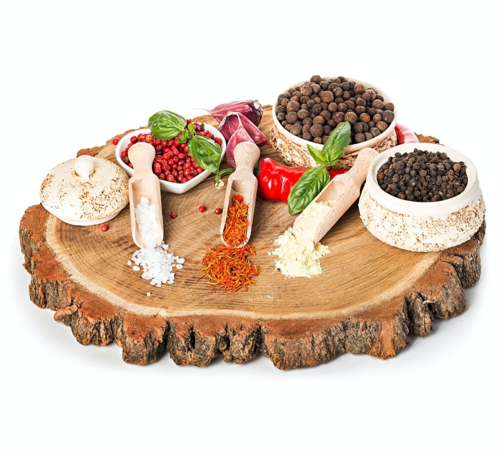 Spices and seasonings on a wooden background